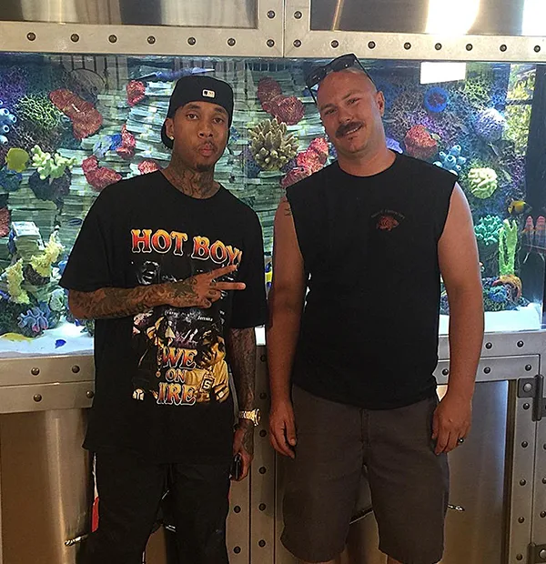 Aquatic Contractors owner Brian Hoover with client Tyga